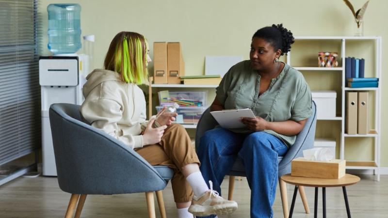 two females sitting chatting